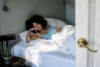 black woman in bed chilling