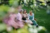 Happy senior women friends laughing on a bench outdoors — warm, candid vibe