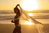 Feminine silhouette in soft focus: walking on a beach at golden hour—calm, confident, and private