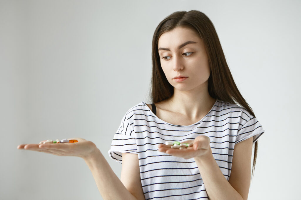 a woman is facing a hormonal imbalance and breast pain deciding to use the right supplements for her