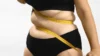 woman has a belly fat searching for best supplement for perimenopause belly fat