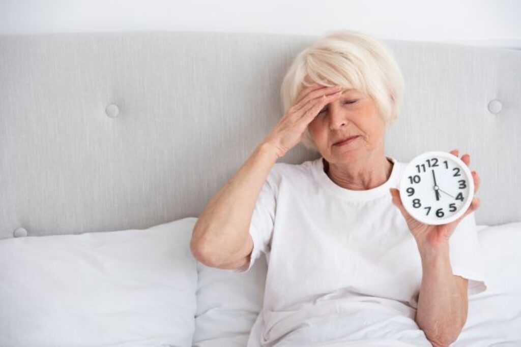 A senior woman suffering with Menopause and Insomnia