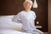 A senior woman struggling with back pain menopause