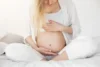 pregnant woman waiting to carry her baby after going through how to avoid miscarriage with pcos