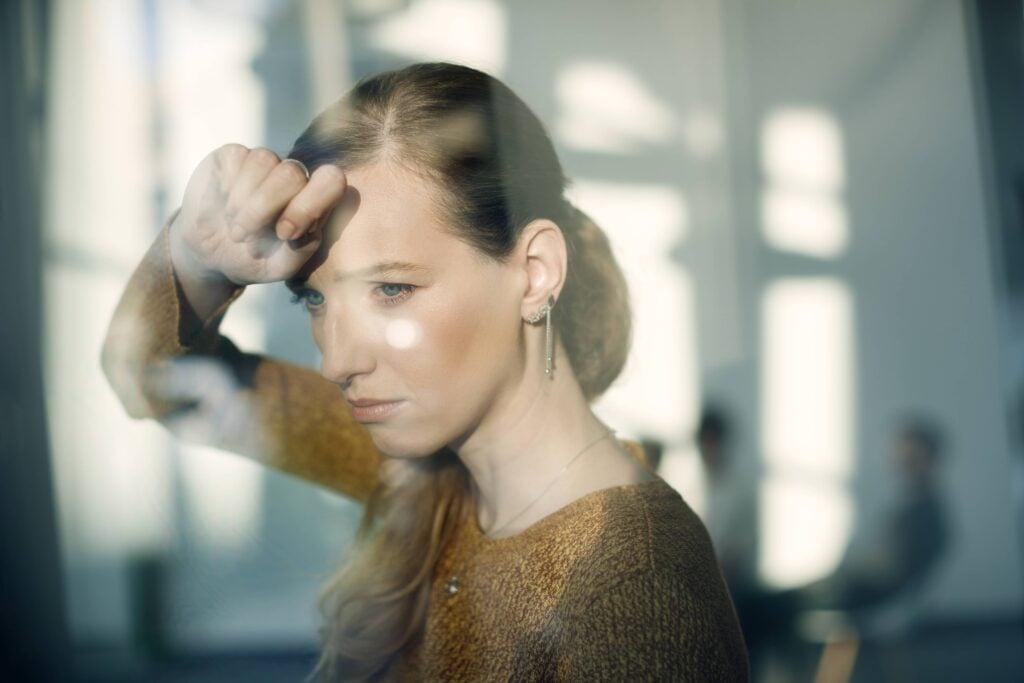Woman worried unable to sleep - poor sleep worsening hair loss after menopause